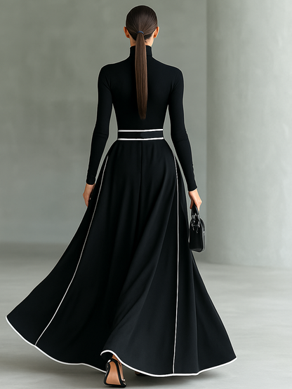 Gina – Vestido Maxi Negro de Mujer con Costuras Blancas, Cuello Alto, Manga Larga y Cintura Entallada